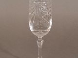 a wine glass that is sitting on a table