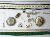 a close up of a bunch of jewelry on a table