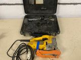 a tool box with tools on a table next to a wall
