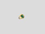 a close up of a gold ring with a green stone
