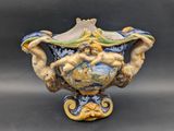 a vase with a man on it on a table