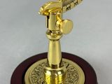 an image of a brass plated sundial on a wooden base