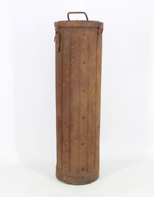 an old wooden cylinder with a metal handle on a white background