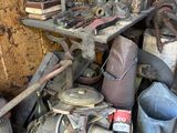 a pile of junk that is sitting in a garage