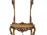 une table en bois richement sculptée, surmontée d'un miroir