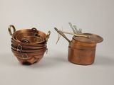 many pots and pans that are sitting on the table