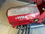 a red machine that is sitting on the floor