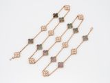 a close up of a group of bracelets on a white surface
