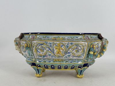 un bol bleu et jaune orné d'un motif doré