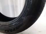 a close up of a tire on a white surface