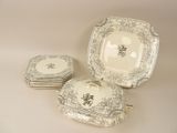 four plates and a bowl sitting on a table