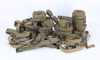 a pile of military equipment on a white surface