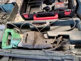 a tool box with tools in it sitting on the floor