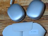a pair of headphones and a pair of glasses on a wooden floor