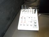 a control board sitting on a table next to a wall
