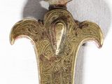 a gold colored metal object with a bird on top of it