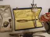 a box with a knife, fork, spoon, and other items on it