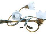 two flowers that are on the stem of a light fixture