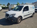 a white van that is parked in a parking lot