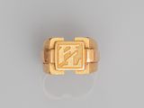 an image of a gold ring with the letter n on it