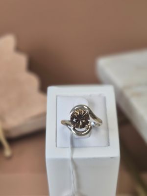 a ring that is sitting in a box on a table