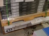 a large stack of boxes on a pallet in a warehouse