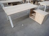 many desks and chairs in a room with no one on them