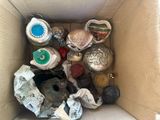 a cardboard box filled with assorted items in it