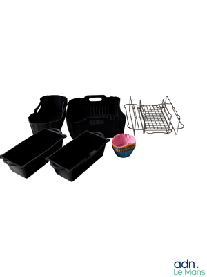 a cupcake sitting on a plate next to a rack and pans