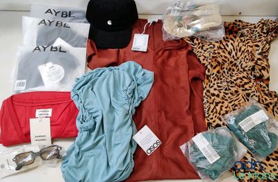 a lot of clothes and a hat on a table