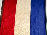 a red, white, and blue flag on a table