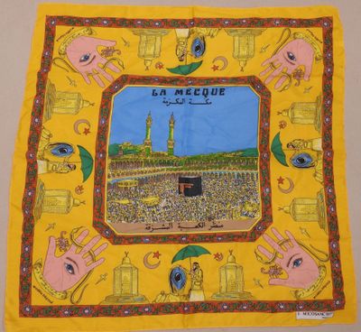 a yellow scarf with a picture of the kaabah mosque