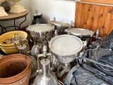 many pots and pans that are sitting on the floor