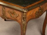 a wooden table with a marble top on it