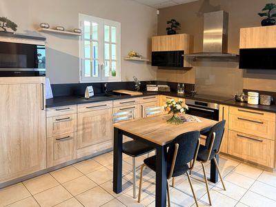 a kitchen with a table and chairs in it