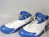 pair of blue and white sneakers with white laces on them