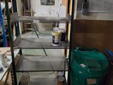 a metal shelf with several shelves and a green trash can