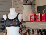 a female mannequin in a black bra top and black panties