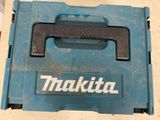 a blue tool box with a black handle on a table