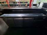 stainless steel counter top in a restaurant kitchen with a lot of counter space