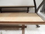 a wooden table with two benches on top of it