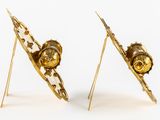 two pairs of gold plated earrings on a white background