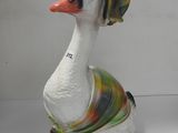 a white duck with a colorful hat on it ' s head