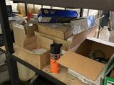 many boxes and boxes on a shelf in a room