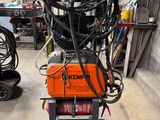 a machine that is sitting on a cart in a garage