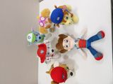 a bunch of stuffed animals that are on a wall