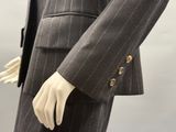 an image of a mannequin wearing a suit and tie
