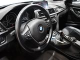 a steering wheel and dashboard of a bmw car