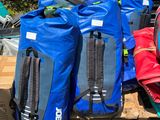 many bags of luggage sitting in the back of a truck
