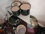 three drums sitting on a table in a room